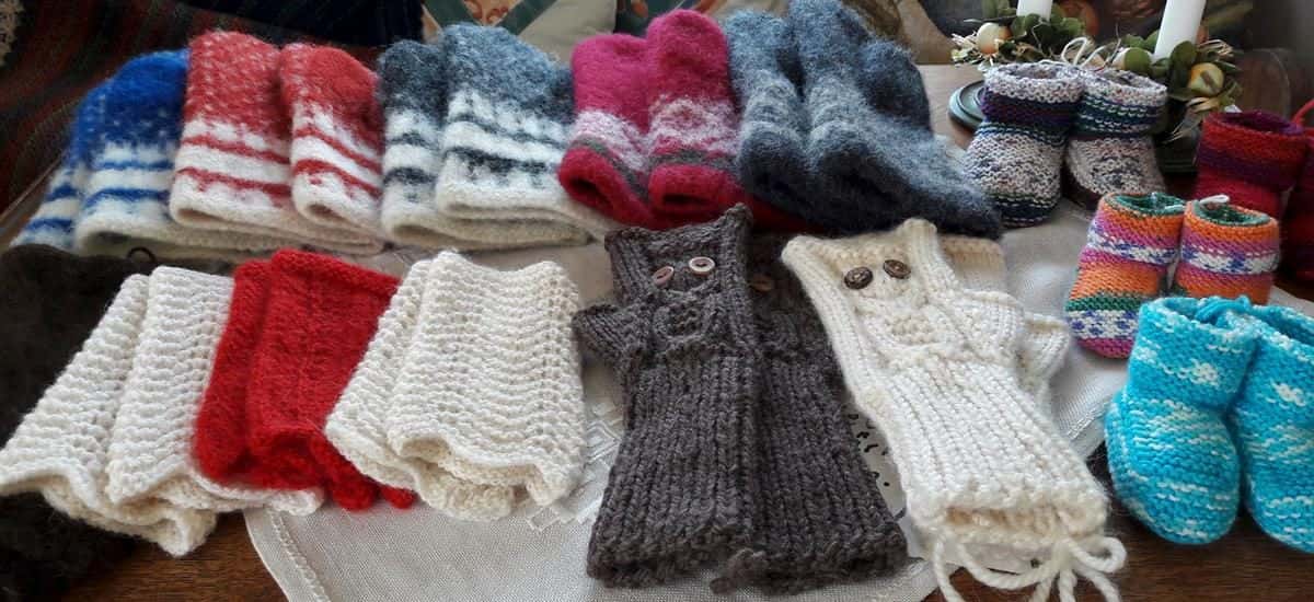 A display of beautiful hand knitted boots, hats and gloves made by Elizabeth from Meet the Locals